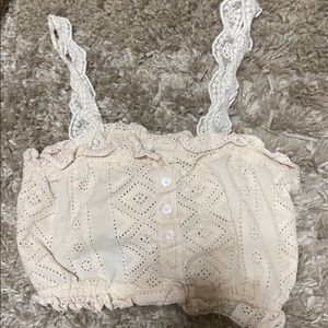 A cropped button strapped shirt